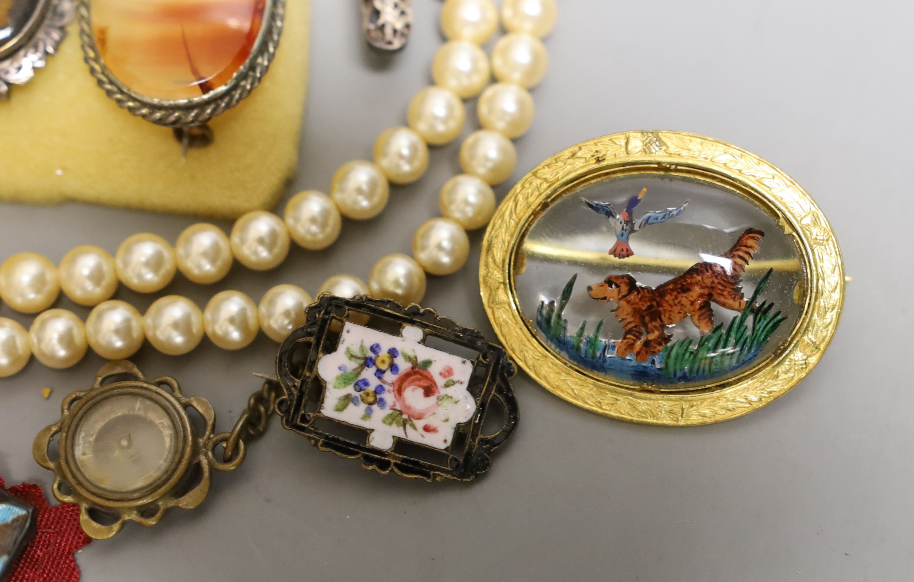 A Victorian pinchbeck and paste set brooch and a group of assorted costume jewellery including enamel.